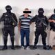 Elementos de seguridad junto al asesino del jefe de policía deLinares